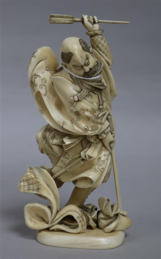 A Japanese ivory okimono of a warrior